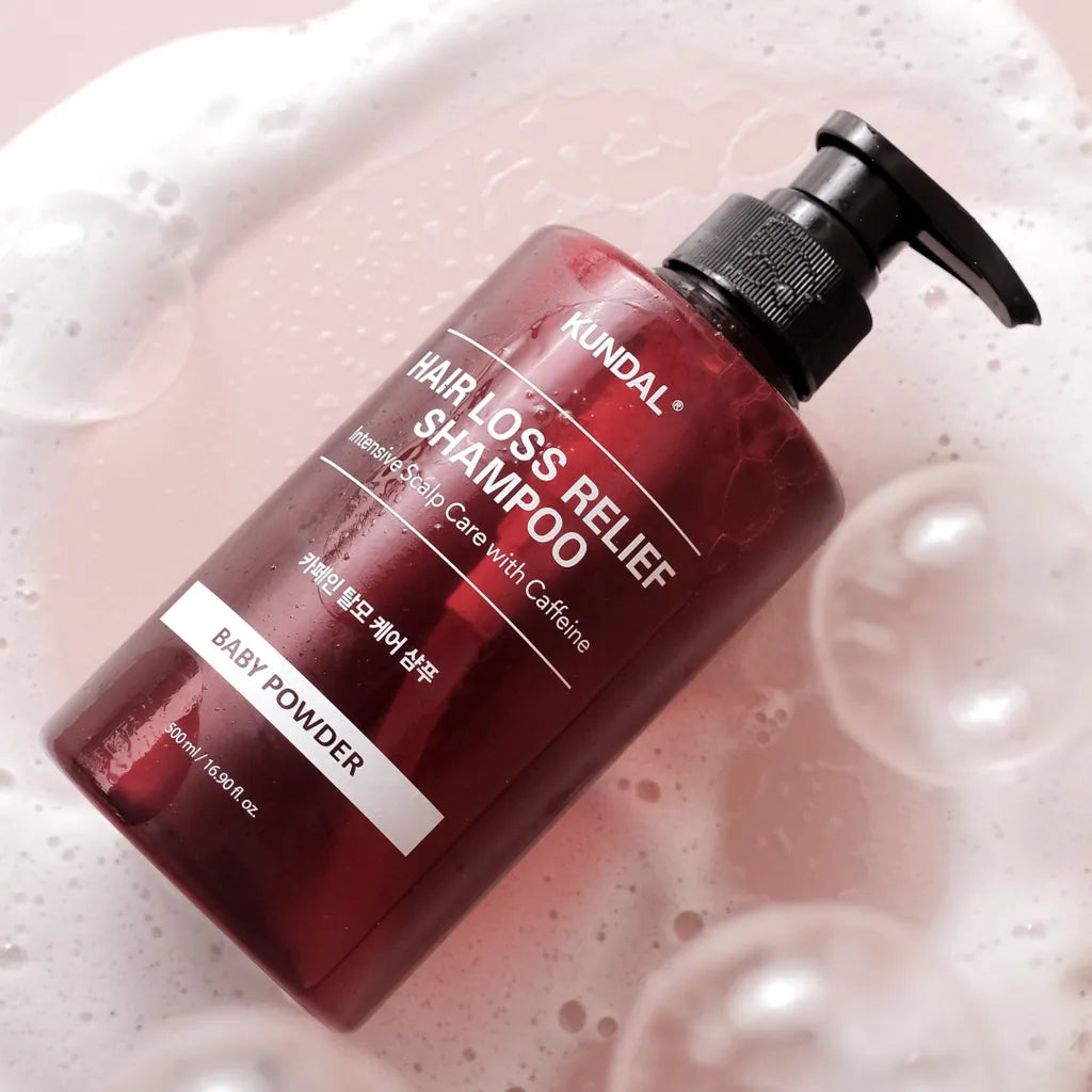 KUNDAL Natural Caffeine Hair Care Shampoo Baby Powder scented shampoo formulated to cleanse the scalp and help strengthen hair.