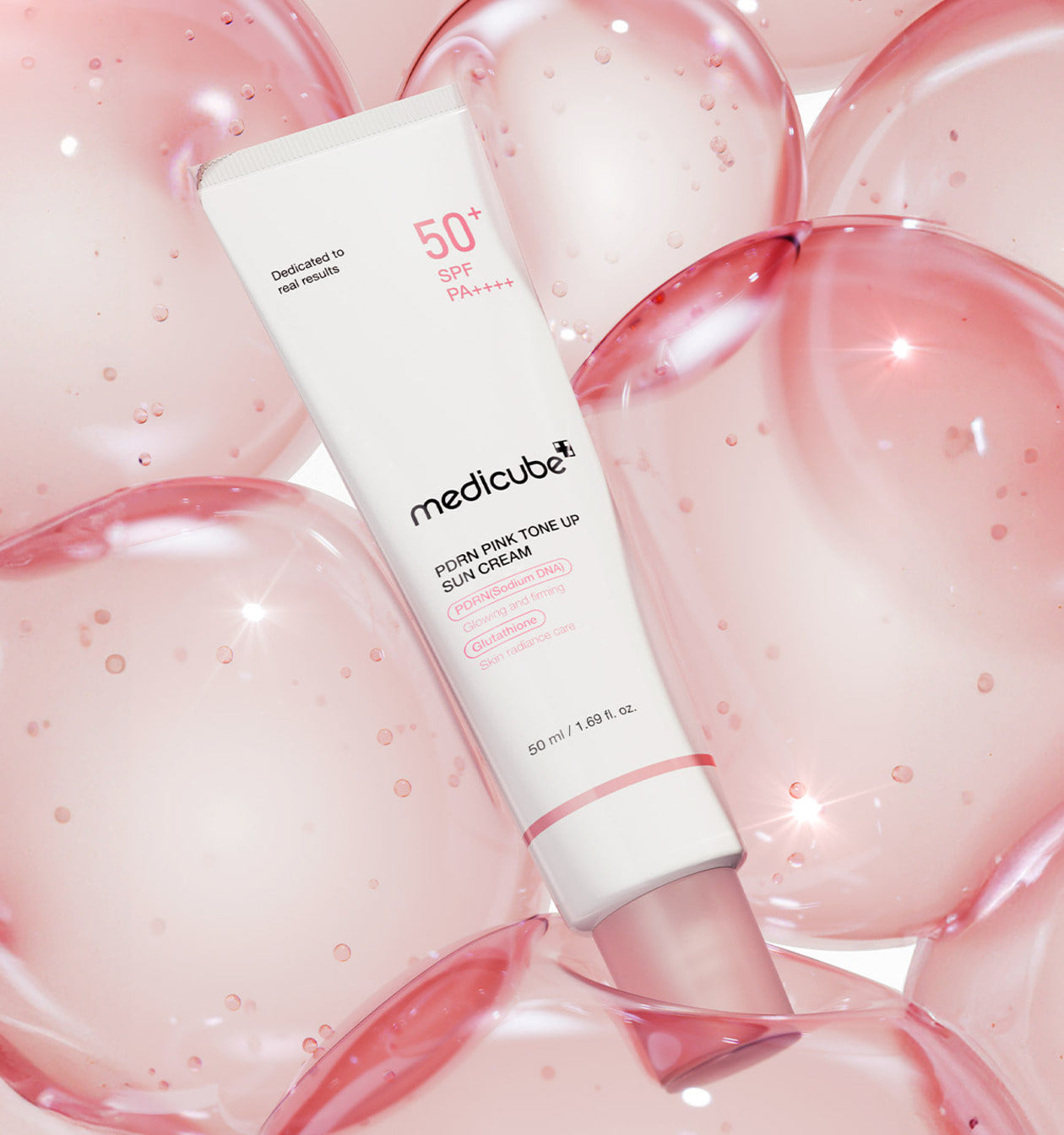 PDRN tone-up sun cream that brightens dull skin with a peachy-pink finish
