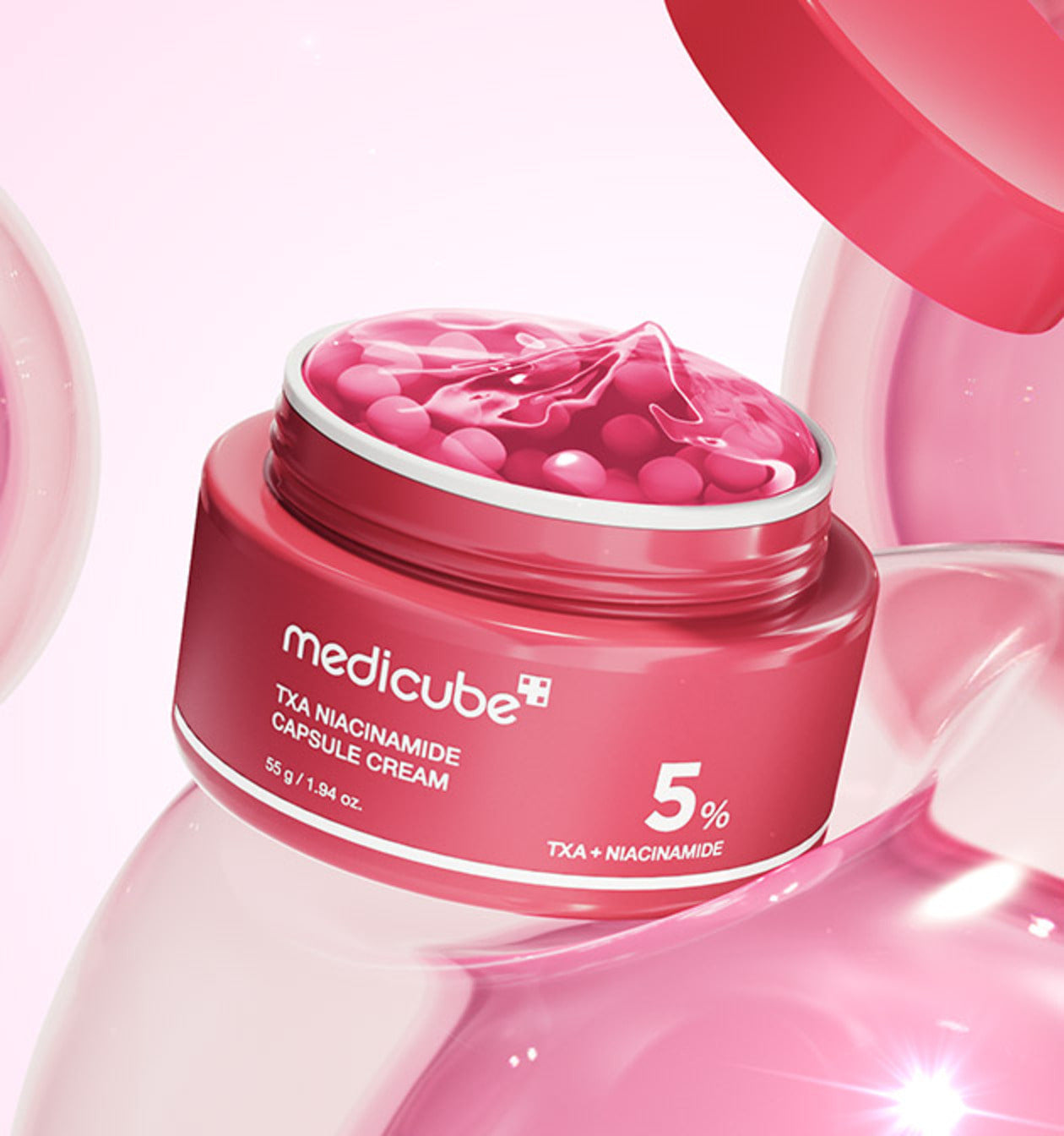 Pink capsule and red gel cream with tranexamic acid that targets melasma and pigmentation
